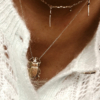 accumulation colliers plaqué or tendance pendentifs croix scarabée porte bonheur bijoux créateurs fait main france