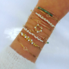 bracelets joncs semainier fin or perles simple destroy tissage pierres précieuses émeraudes et perles nacres blanches or fait main en france bijoux créateur tendance